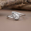 solitaire pear halo ring