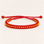 Ruby Red & Golden Yellow Woven Soft Thread Bracelet