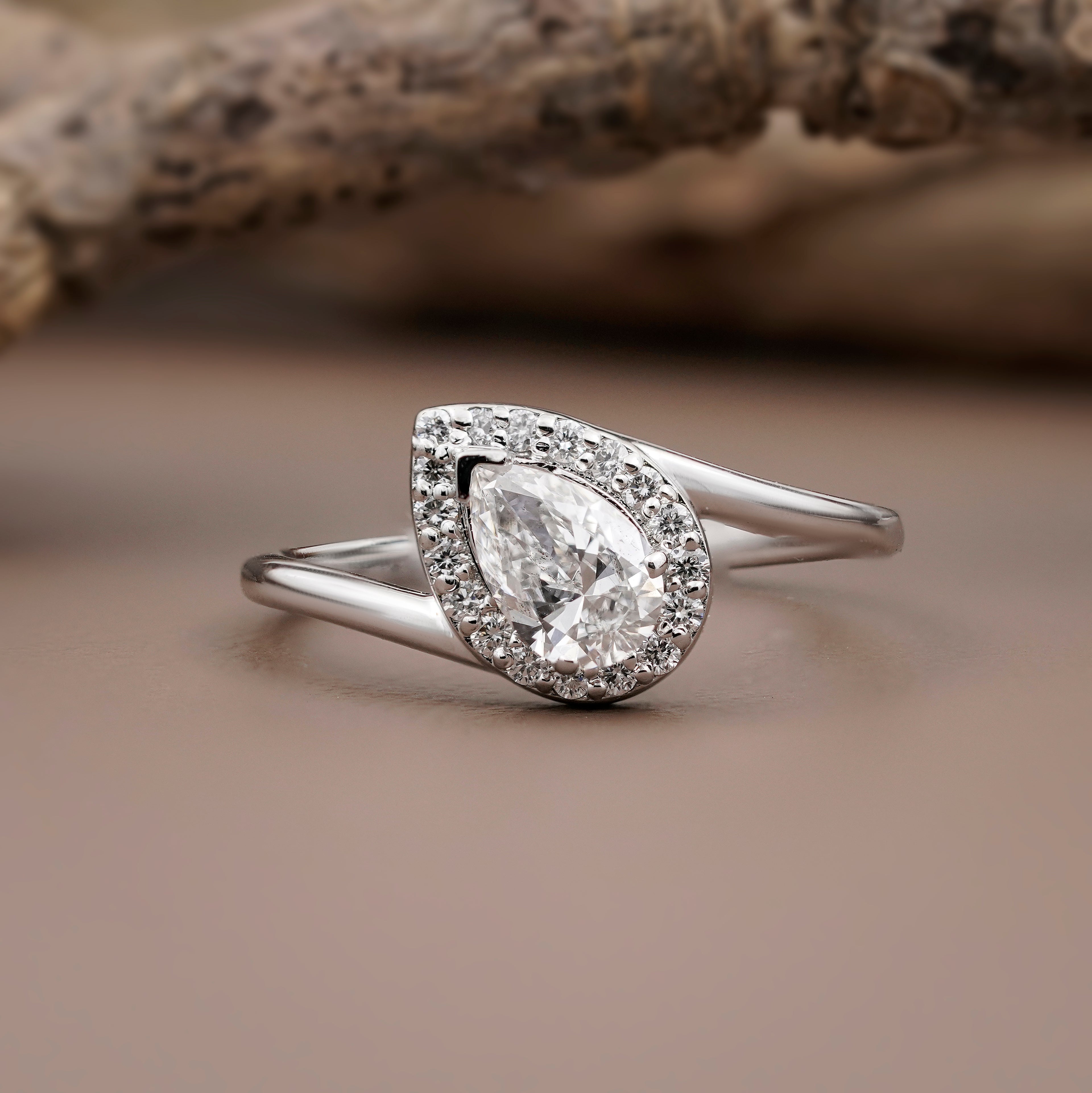 solitaire pear halo ring