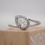 solitaire pear halo ring