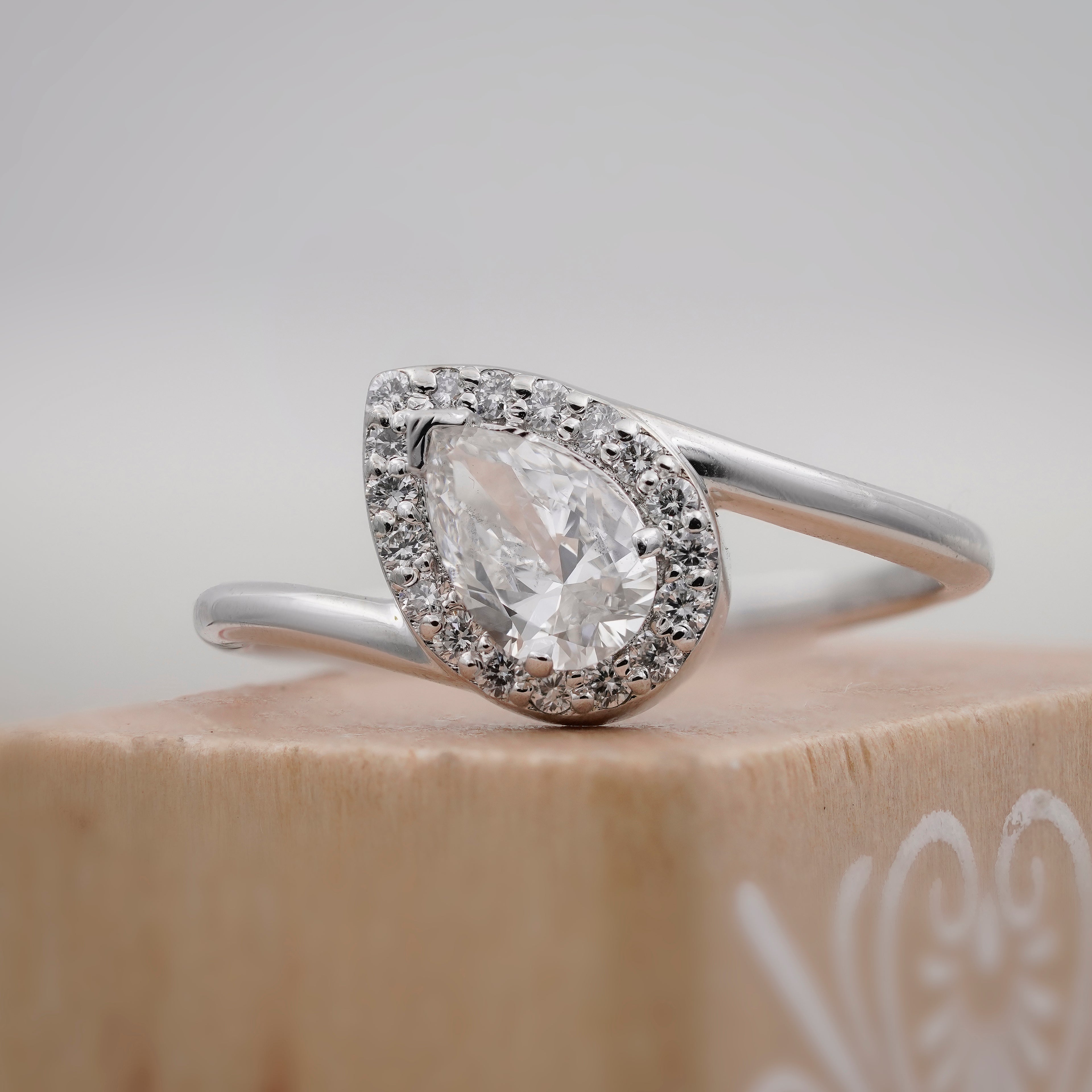 solitaire pear halo ring