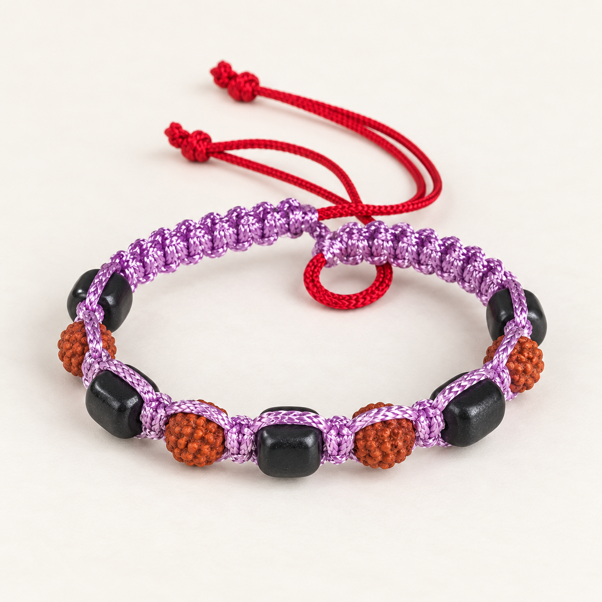 Handcrafted Rudraksha, Black Bead & Purple Cord Bracelet Main image
