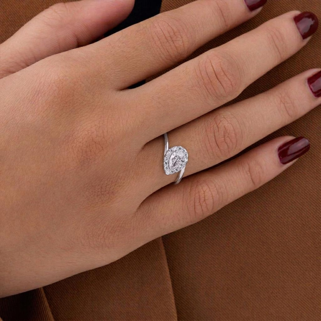 solitaire pear halo ring